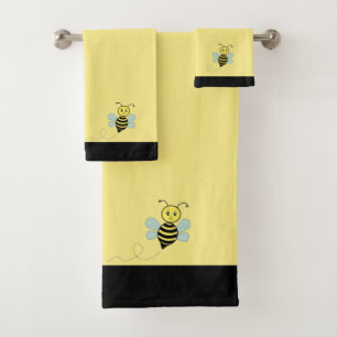 Abeille à miel sur serviettes de bain noires et ja