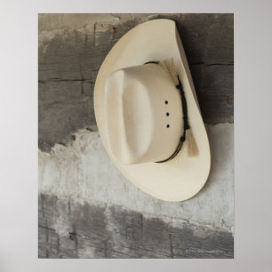 Affiche Casquette de cowboy accrochant sur le mur du