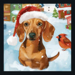 Affiche Dachshund Winter Wonderland Christmas Joy<br><div class="desc">Ce design festif reflète l'esprit joyeux de la période des fêtes, avec un adorable petit portant un chapeau de Père Noël. Le chien est niché dans un pays des merveilles hivernales, avec un bonhomme de neige, un sapin de Noël décoré et des cadeaux joliment emballés. Les flocons de neige tombent...</div>