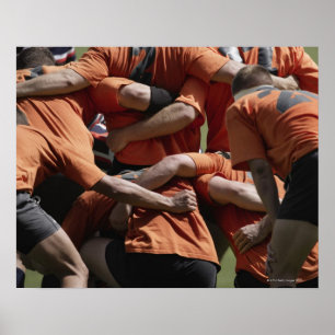 Affiche Male rugby players in scrum, rear view