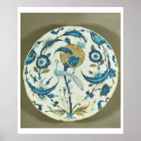 Plat d'Iznik peint d'un paon perché au milieu de f