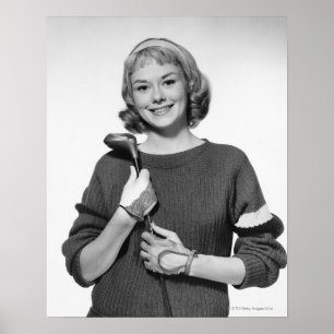 Affiches Femme tenant le club de golf