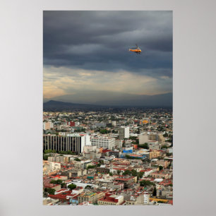 Affiches High Angle View Of Cityscape Against Cloudy Sky