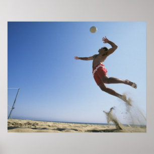 Affiches Joueur de beach volley masculin qui saute jusqu'à 