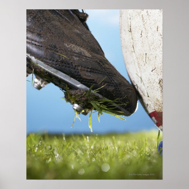 Affiches Rugby player kicking ball off tee, close up of (Devant)