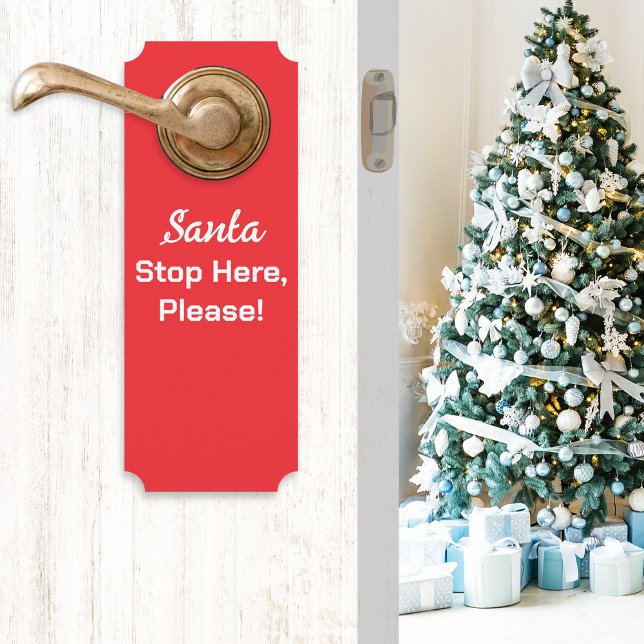 Affichette De Porte Santa Stop Here Please Festive Rouge (A red Christmas door handle hanger with message 'Santa Stop Here, Please!' in white typography)