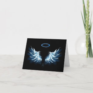 Ailes d'ange lumineuses bleues sur fond noir