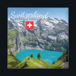 Aimant Alpine lake Oeschinensee in Switzerland with flag<br><div class="desc">Souvenir photo magnet with the turquoise Oeschinensee lake,  surrounded by high alpine mountains on a summer day in the Alps,  high above Kandersteg in Bernese Oberland,  Switzerland with the text: 'Switzerland,  Bernese Oberland' and a swiss flag.</div>