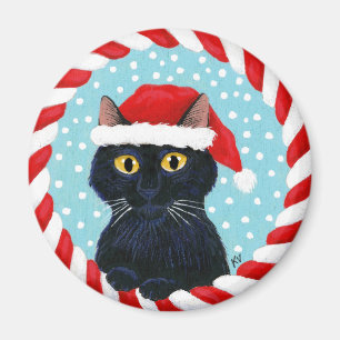 Aimant Chat noir mignon, casquette de Père Noël, neige