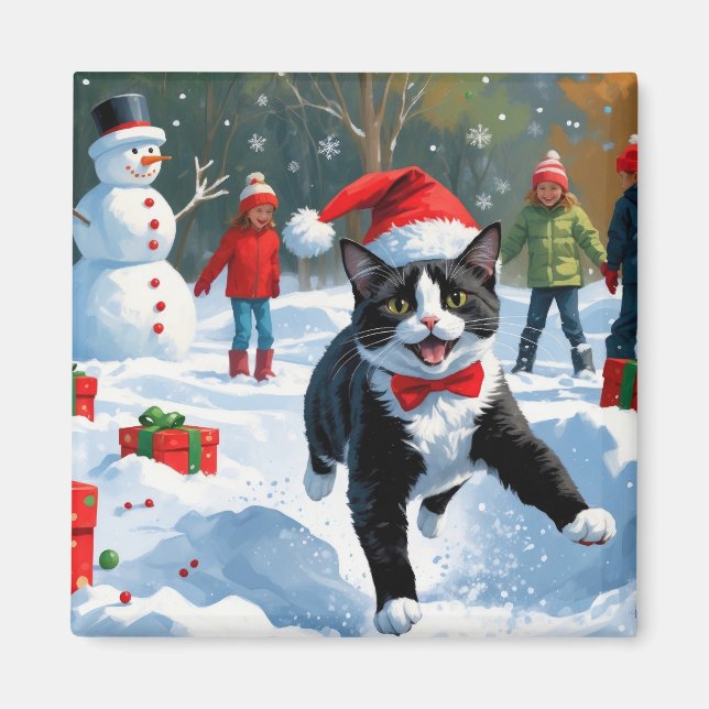 Aimant Chat Tuxedo Courant dans la Neige avec un Chapeau  (Devant)