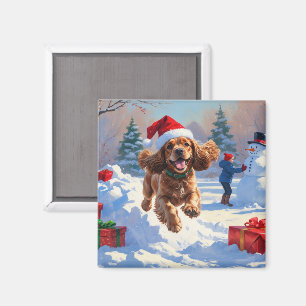 Aimant Cocker Spaniel courant dans la neige avec un chape