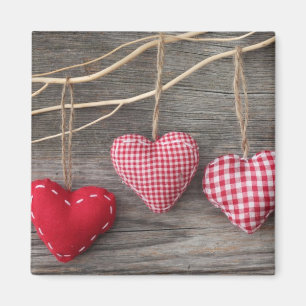 Aimant Coeurs rouges sur table en bois