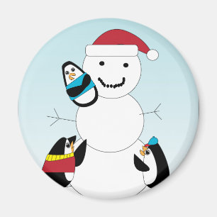 Aimant Des pingouins construisent un bonhomme de neige en