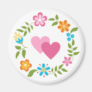 Aimant Deux coeurs avec une couronne de fleurs