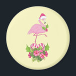Aimant Flamant rose rose à Santa Hat Noël Whimsical<br><div class="desc">Un aimant avec un flamant de Noël à thème tropical portant un chapeau de santa rose. Sous ses pieds se trouve un bouquet de sucre de canne avec de jolies fleurs tropicales et des baies roses. Un bourgeon de saint sur sa poitrine.</div>