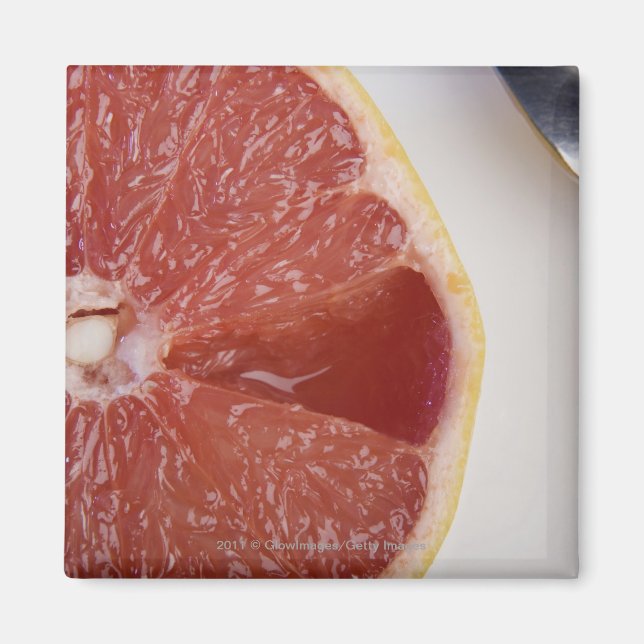 Aimant Gros plan d'une tranche d'orange et une cuillère (Devant)