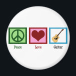 Aimant Guitare Peace Love<br><div class="desc">Un signe de paix,  un coeur et un design de guitare font un grand cadeau à quelqu'un dans un groupe.</div>