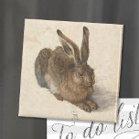 Aimant Jeune lièvre | Albrecht Dürer<br><div class="desc">Le jeune lièvre d’Albrecht Dürer (1502) est un tableau d’aquarelle méticuleusement détaillé qui présente une représentation réaliste d’un lièvre. Réputé pour son réalisme extraordinaire, l’oeuvre capture la texture de la fourrure de lièvre, la lumière délicate dans ses yeux et le jeu subtil de l’ombre. Ce chef-d’oeuvre démontre l’habileté de Dürer...</div>