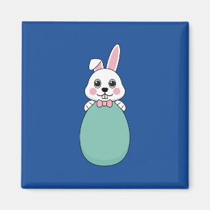 Aimant Joli lapin blanc tenant l'oeuf de Pâques