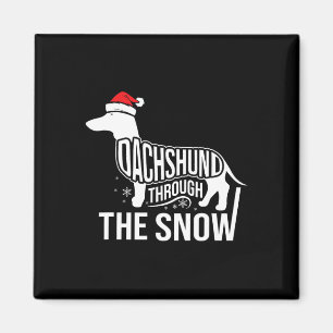 Aimant Joyeux Chien De Noël À Travers La Neige Coupée