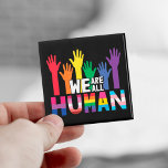 Aimant LGBTQ fierté Nous sommes tous des mains arc-en-cie<br><div class="desc">Répandez un peu d'égalité et montrez au monde que vous êtes un fier membre de la communauté LGBTQ ou que vous soutenez la communauté LGBT avec cet aimant coloré de sensibilisation gay pride qui présente une illustration des mains de couleur arc-en-ciel avec la citation "Nous sommes tous humains".</div>