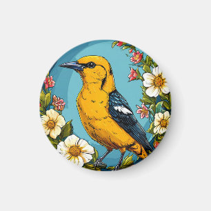 Aimant Loriot doré coloré parmi les fleurs épanouies