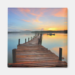Aimant Mer de quai en bois dans le coucher de soleil colo
