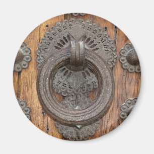 Aimant Metal Knocker on Old Wooden Door