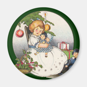 Aimant Noël vintage, fille heureuse jouant avec des poupé