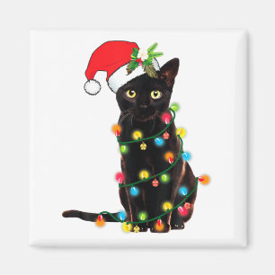 Aimant Père Noël chat noir emmêlé dans les lumières de No