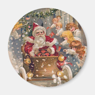 Aimant Père Noël conduit une voiture de course