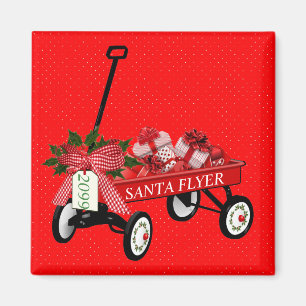 Aimant Père Noël Flyer Wagon présente le réfrigérate