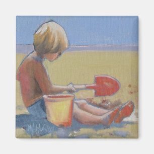 Aimant Petit garçon jouant dans le sable avec une pelle