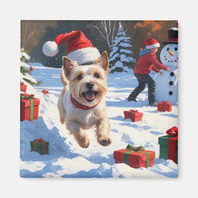 Aimant Terrier Cairn courant dans la neige avec un chapea (Devant)