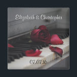 Aimant Touches de piano avec Mariage de rose rouge<br><div class="desc">Photo artistique d'un vieux piano se concentrant sur les vieilles clés jaunes avec une rose rouge défraîchie assise sur les clés et quelques pétales lâches éparpillés. Cette image a une humeur quelque peu mélancolique et sentimentale avec un peu de nostalgie. Customisez avec le nom de la mariée et des mariés...</div>