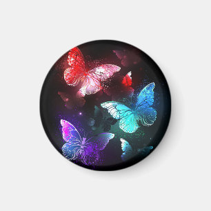 Aimant Trois papillons lumineux sur fond de nuit