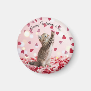 Aimant Un adorable chaton attrape des pétales de fleurs e
