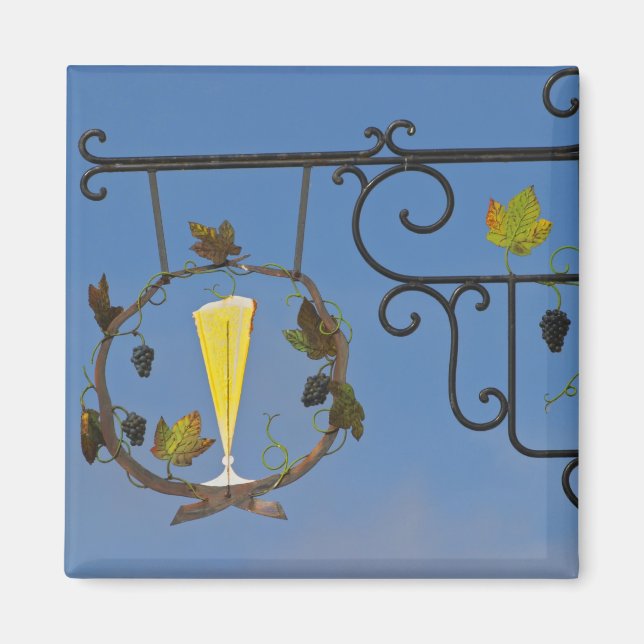 Aimant Une enseigne en fer forgé qui illustre le thème (Devant)