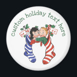 Aimant Vintage Christmas Stockings with Cute Children<br><div class="desc">Vintage illustration Merry Christmas holiday design featuring twins kids hanging in Christmas stockings decorated with holly leaves and berries. The girl is in the blue and white striped stocking and the boy is in the red and white striped stocking. Silly,  funny and humorous image,  great for the whole family!</div>