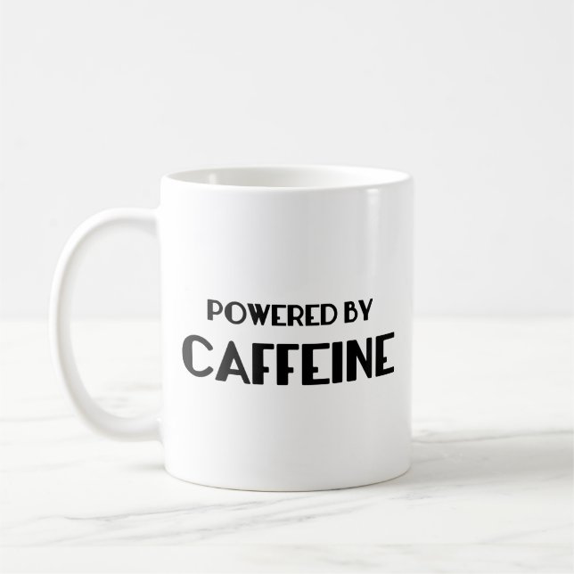 Alimenté Par La Mug De Café À La Caféine (Gauche)