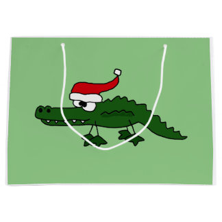 Alligator drôle dans le sac de cadeau de Noël de