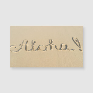 Aloha signe sur le sable de la plage