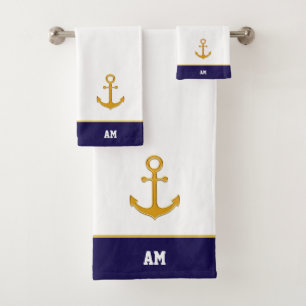 Ancrage en or et monogramme sur bain bleu marine e