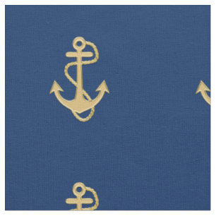Ancre d'or sur le tissu nautique bleu marine