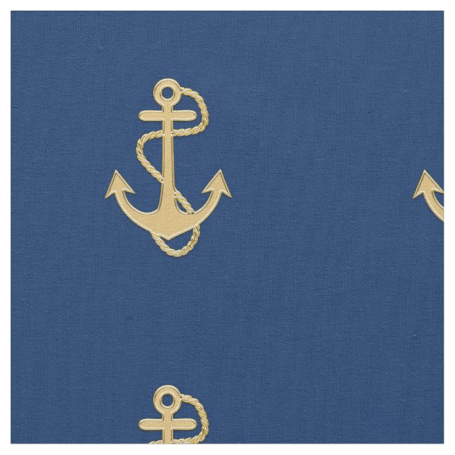 Ancre d'or sur le tissu nautique bleu marine (Fermer)