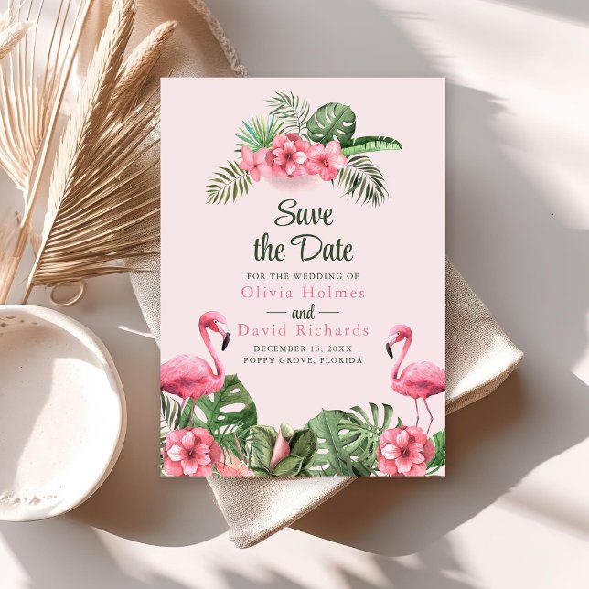 Aquarelle rose flamant tropical faire-part de sauv (Pink Watercolor Tropical Flamingo Save the Date Invitation on sunny table with dry palm leaf.)