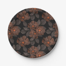 Fleurs orange et marron sur fond noir.