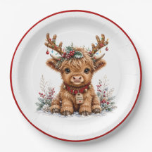 Joli vache Highland de Noël avec des bois festifs