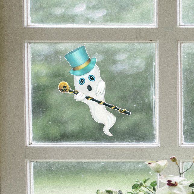 Autocollant Pour Fenêtre Top Chapeau Bleu Fantôme Canne Ornat Gold Crâne (Cute blue eyed ghost wearing top hat holding black cane with gold skull on Halloween window cling.)