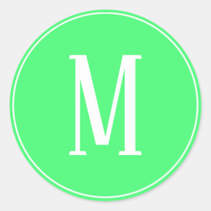 Autocollant rond blanc sur fond vert clair avec mo
